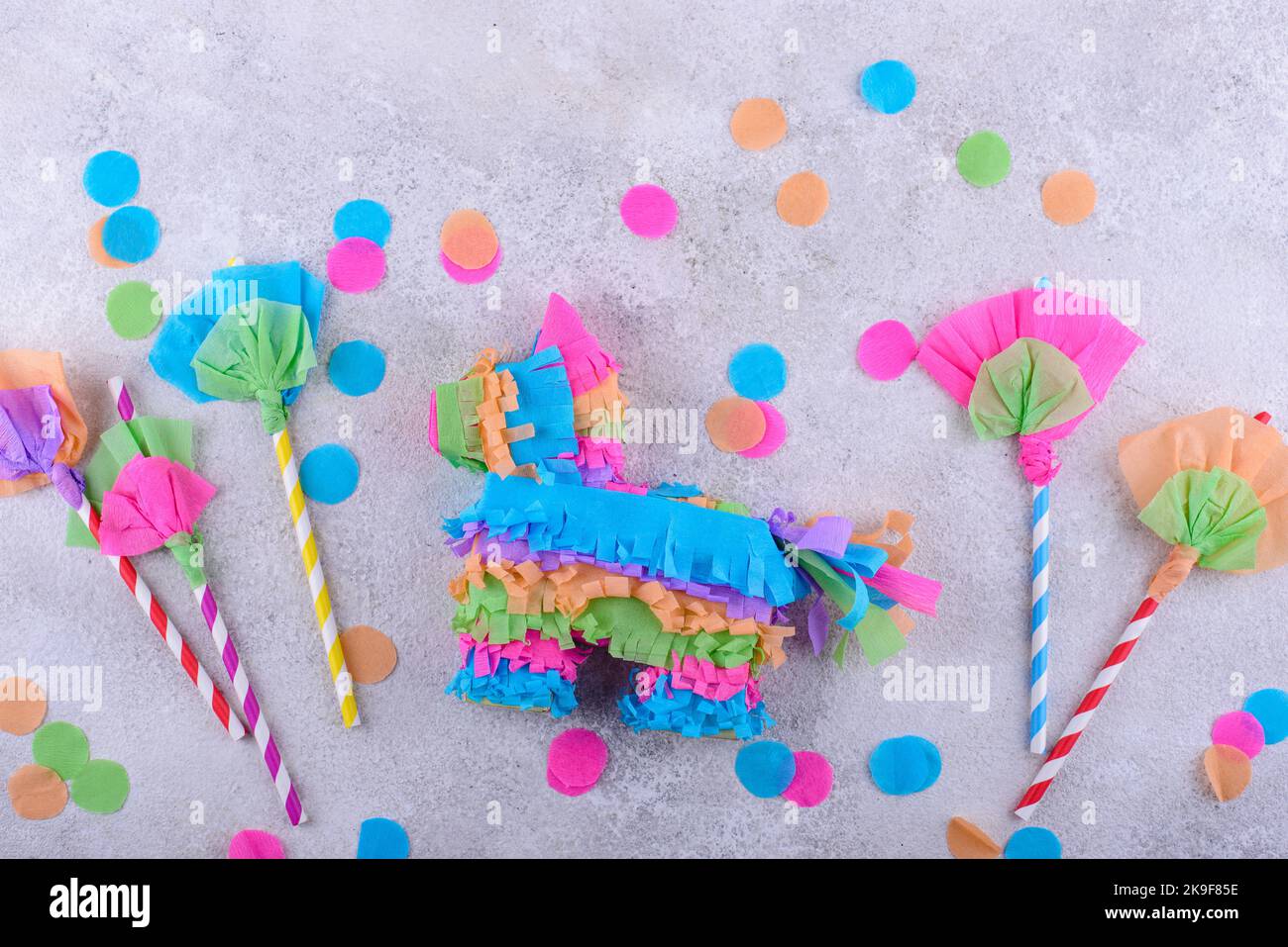 Mexican Paper Flowers and Pinata Stock Photo - Alamy