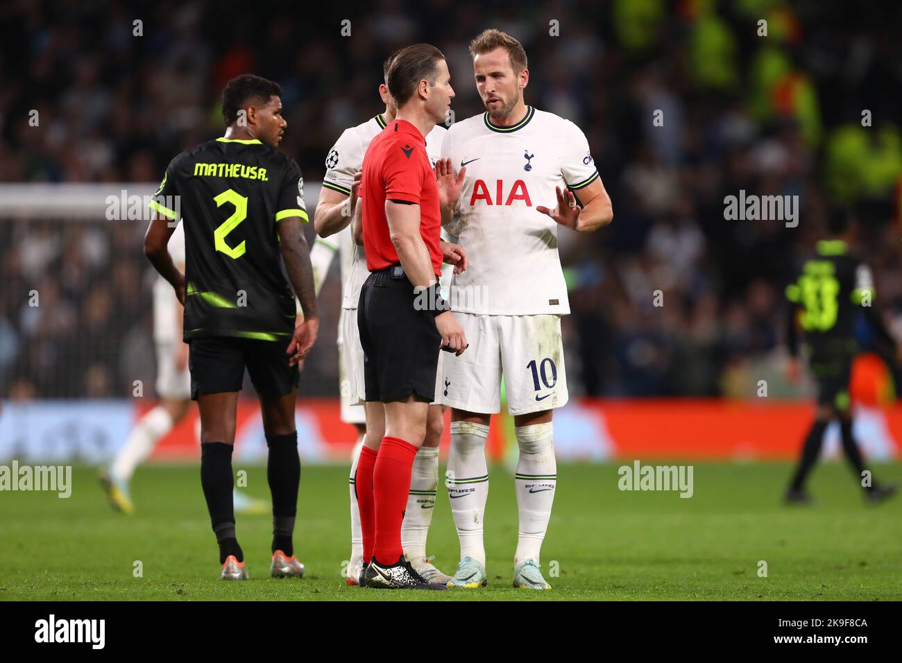 Harry Kane of Tottenham Hotspur is seen with Referee, Danny Makkelie
