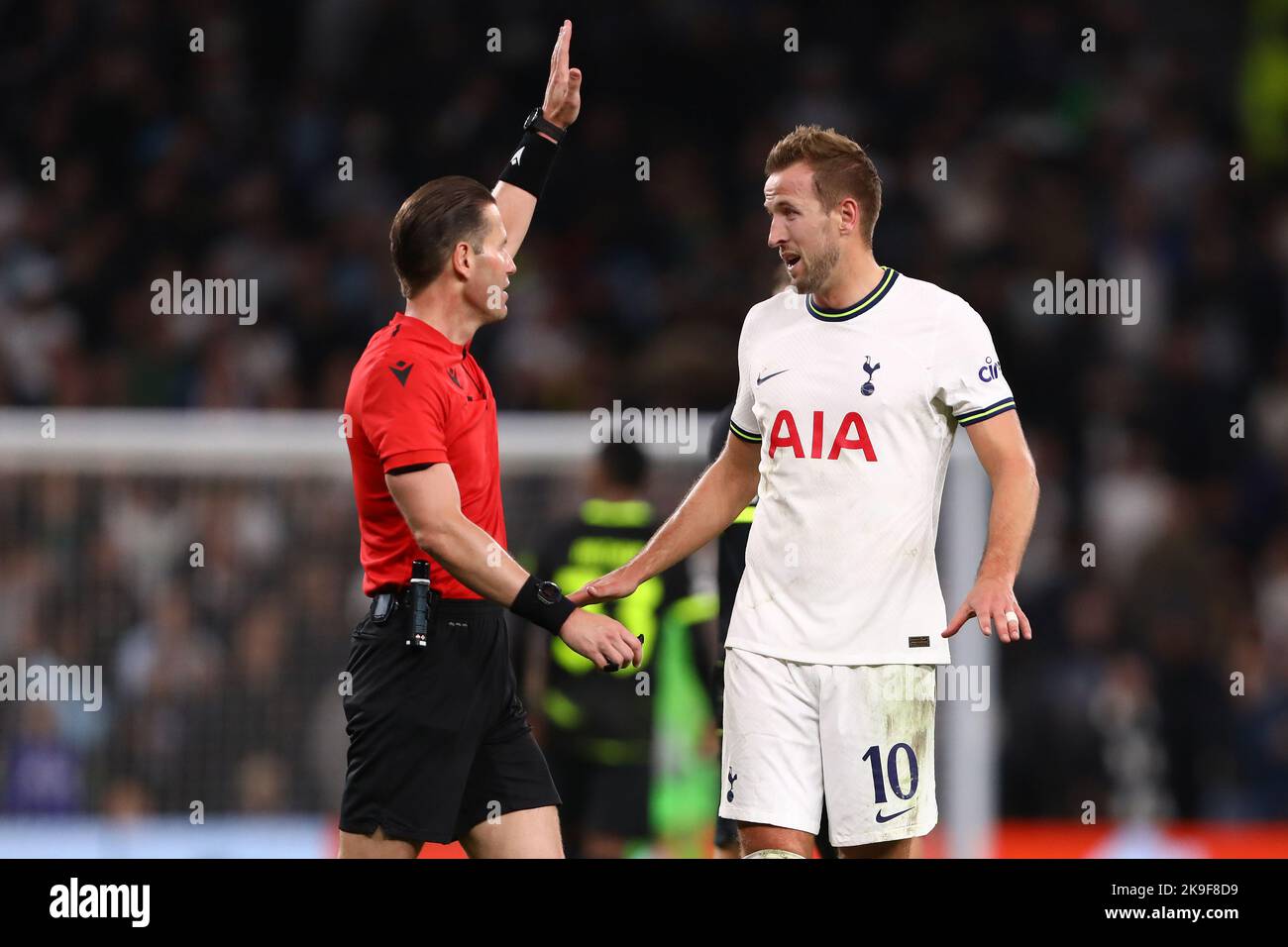 Harry Kane of Tottenham Hotspur is seen with Referee, Danny Makkelie
