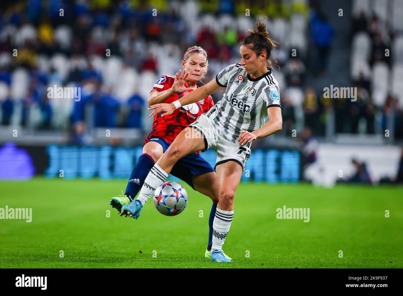 Turin, Italy. 27th Oct, 2022. Eugene Le Sommer (L) of Olympique Lyonnais and Martina Lenzini (R) of Juventus Women FC in action during the UEFA Women's Champions League 2022/23 - Group C football match between Juventus FC and Olympique Lyonnais at the Allianz Stadium. Final score; Juventus 1:1 Lyon. Credit: SOPA Images Limited/Alamy Live News Stock Photo