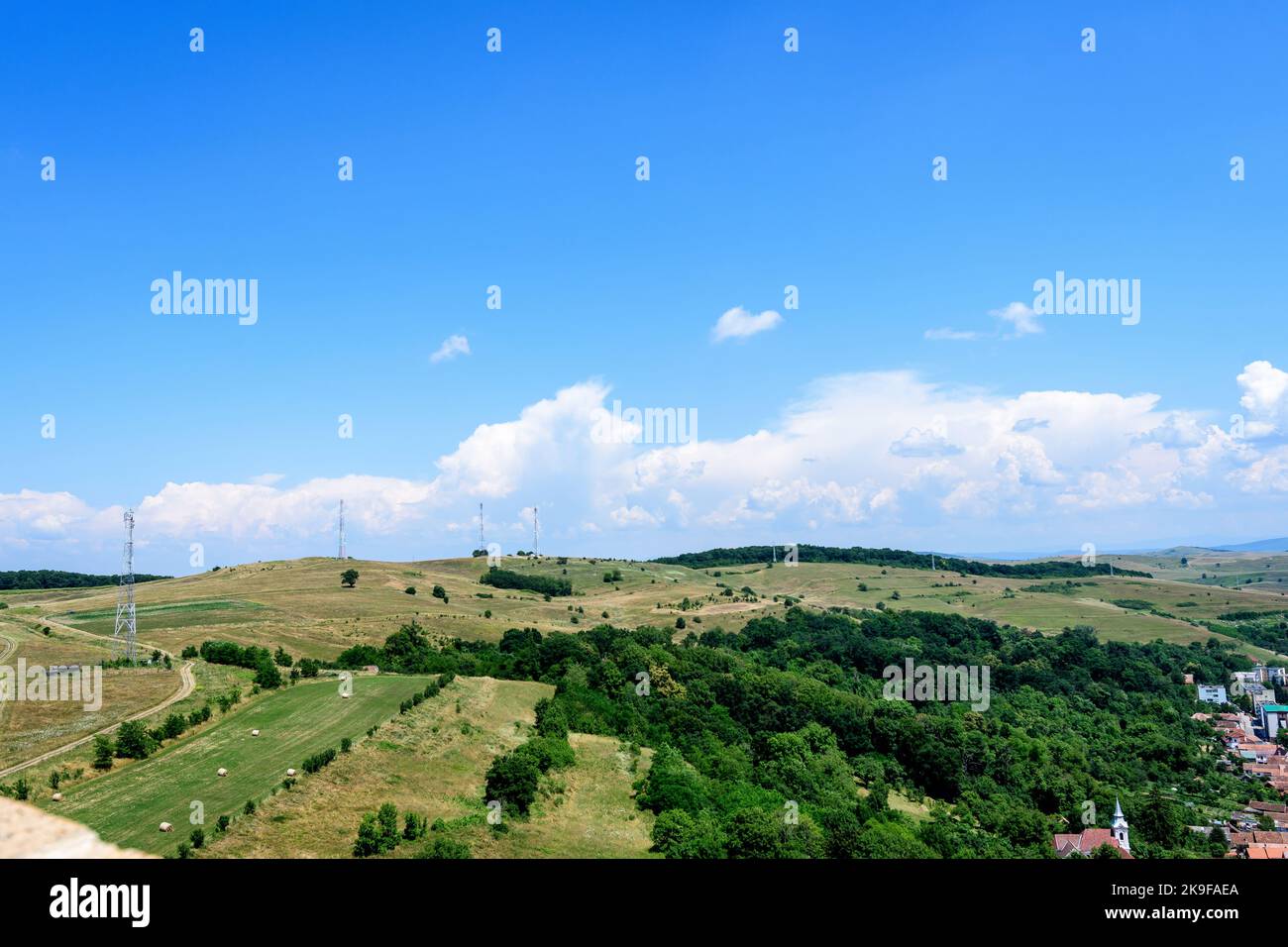 View from the stone walls at the Rupea Citadel (Cetatea Rupea) after renovation towards a small town in Brasov county, in the southern part of Transyl Stock Photo