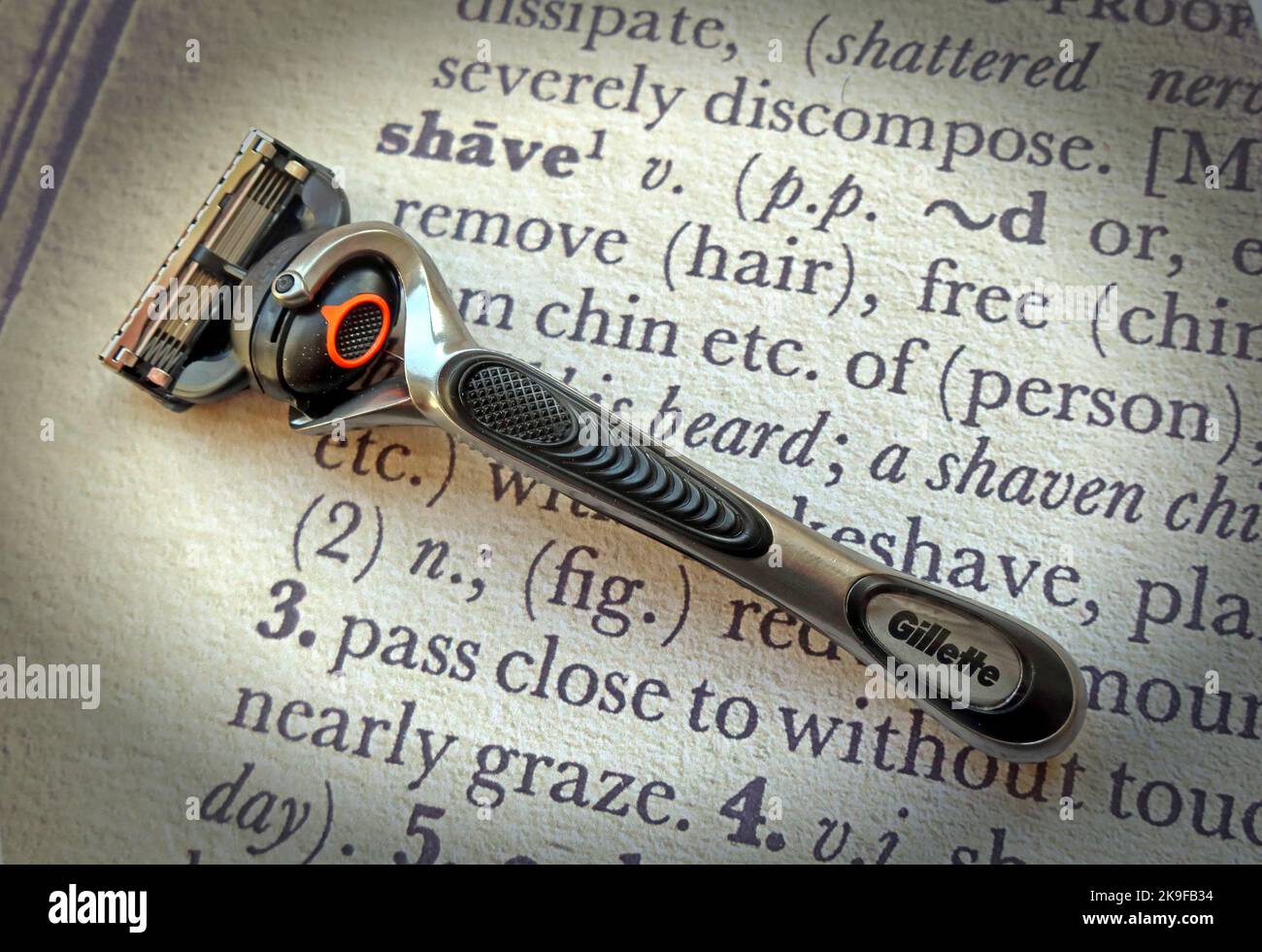 Razor, with expensive blades, on a dictionary definition of 'Razor' Stock Photo
