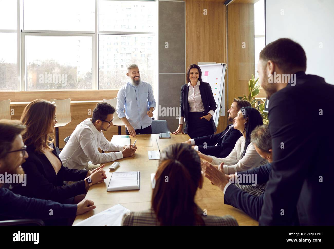 Diverse coaches present project at team meeting Stock Photo Alamy
