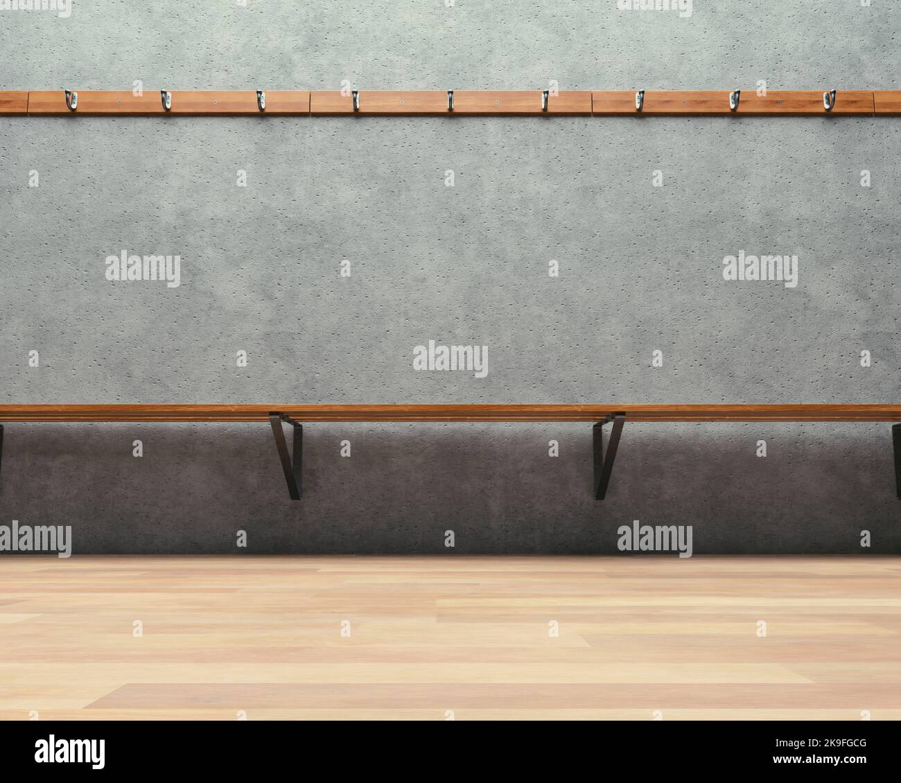 A clothes hanging rack above an empty wooden bench against a concrete ...