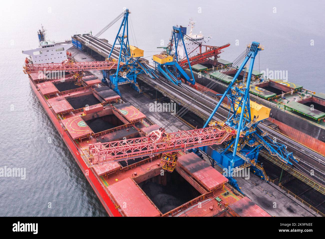 Mooring with ship and technics for an overload of loose cargoes. Stock Photo
