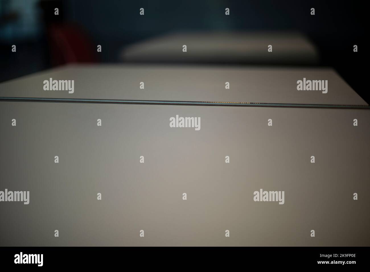 Drawer top cover. Grey drawers on top. Board surface. Table details