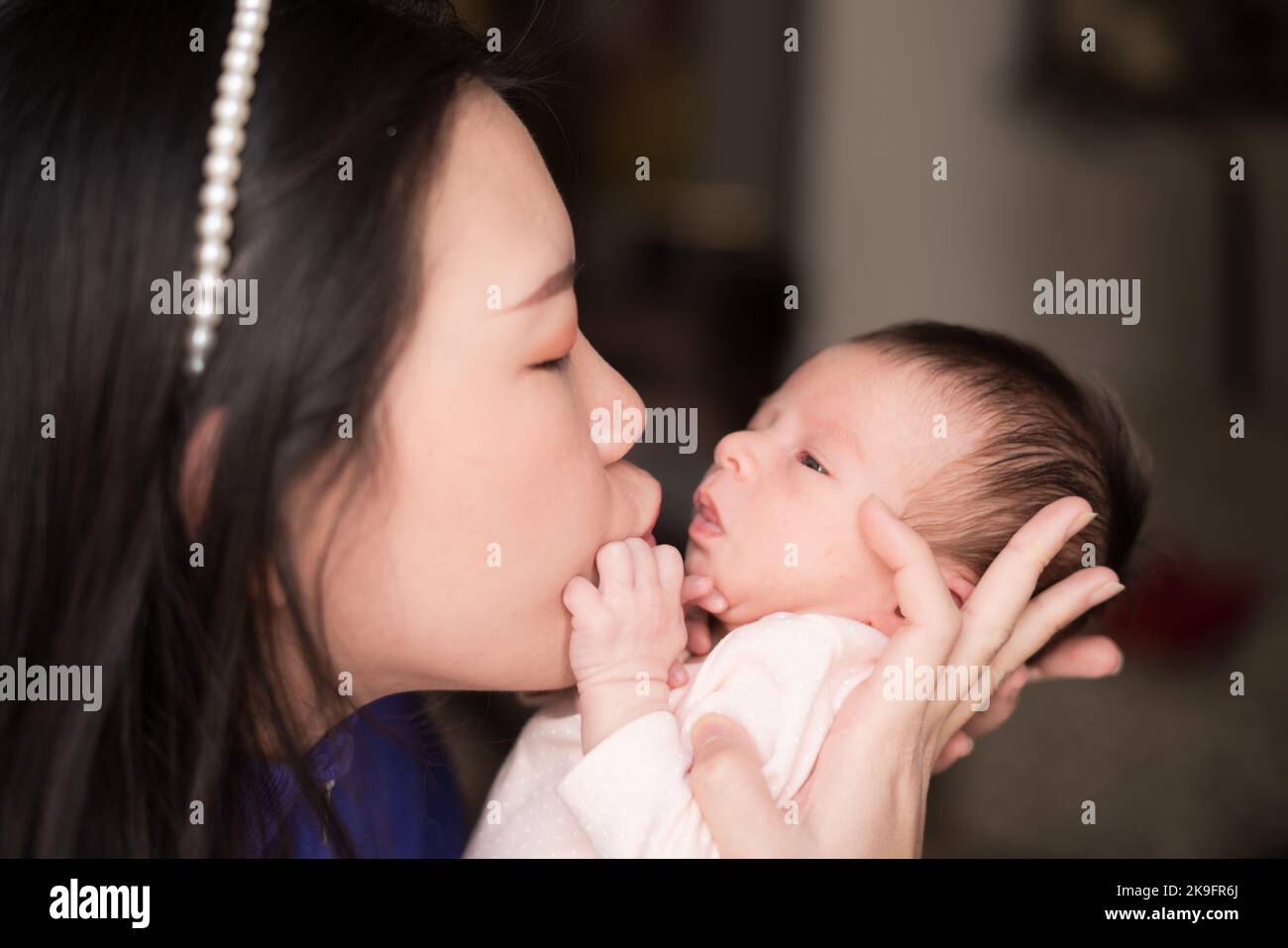 newborn baby with mother Stock Photo