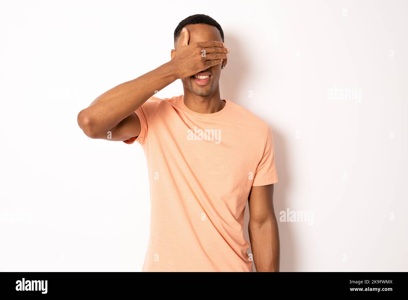 Portrait man covering one eye hi-res stock photography and images - Alamy