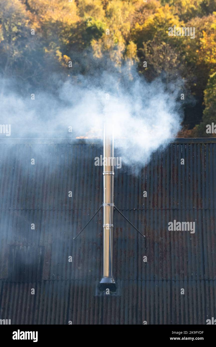 Smoke from wood burner - Scotland, UK Stock Photo