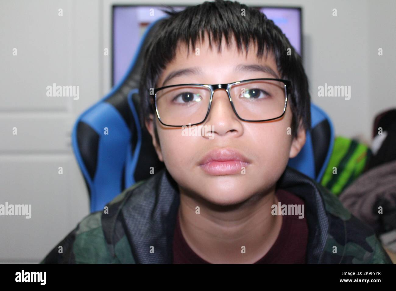 12 Years Old Boy wearing prescription glasses Stock Photo