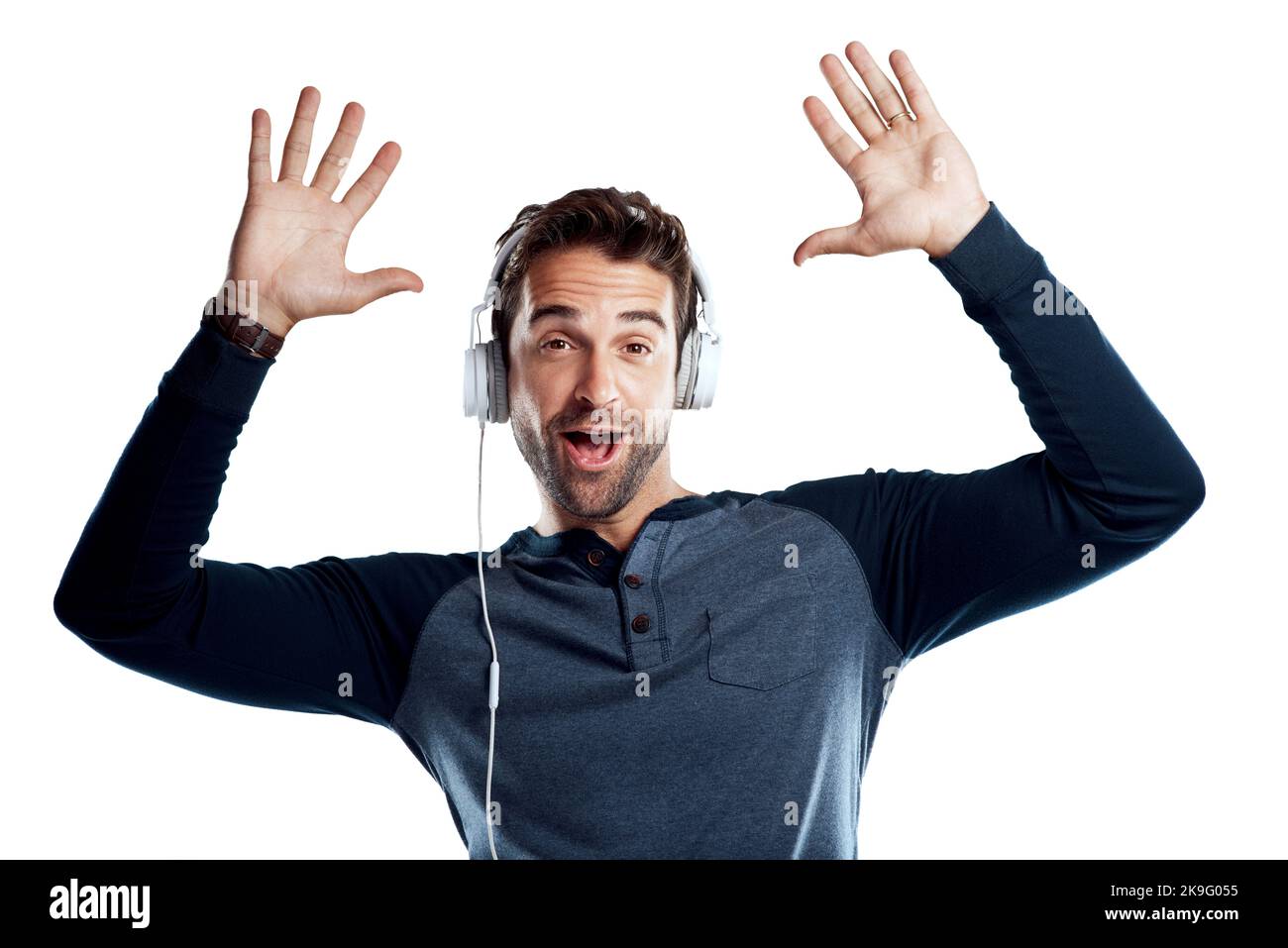 Positive man listening music with headphones, dancing on dark neon  background. Stylish student guy enjoying life, active energy, inspired  dance concept - a Royalty Free Stock Photo from Photocase