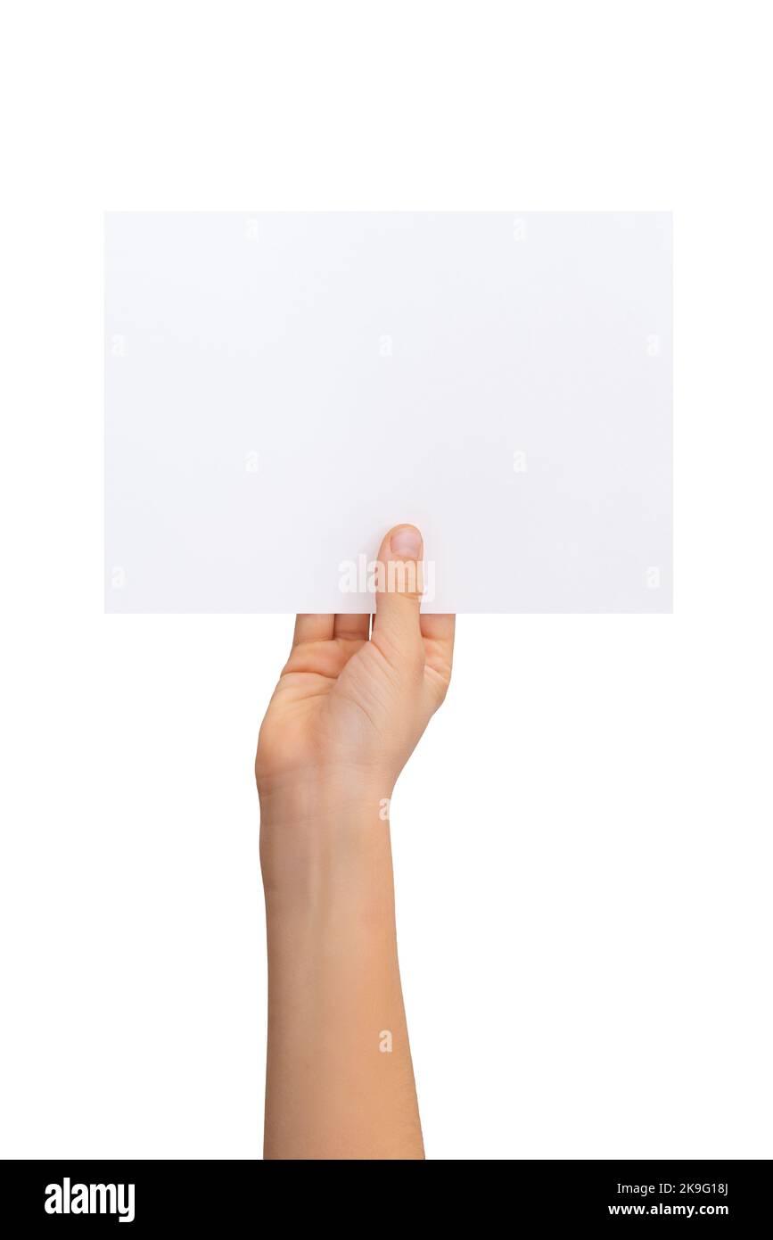 Hand holding blank flyer, sheet of paper in horizontal position with isolated background Stock Photo