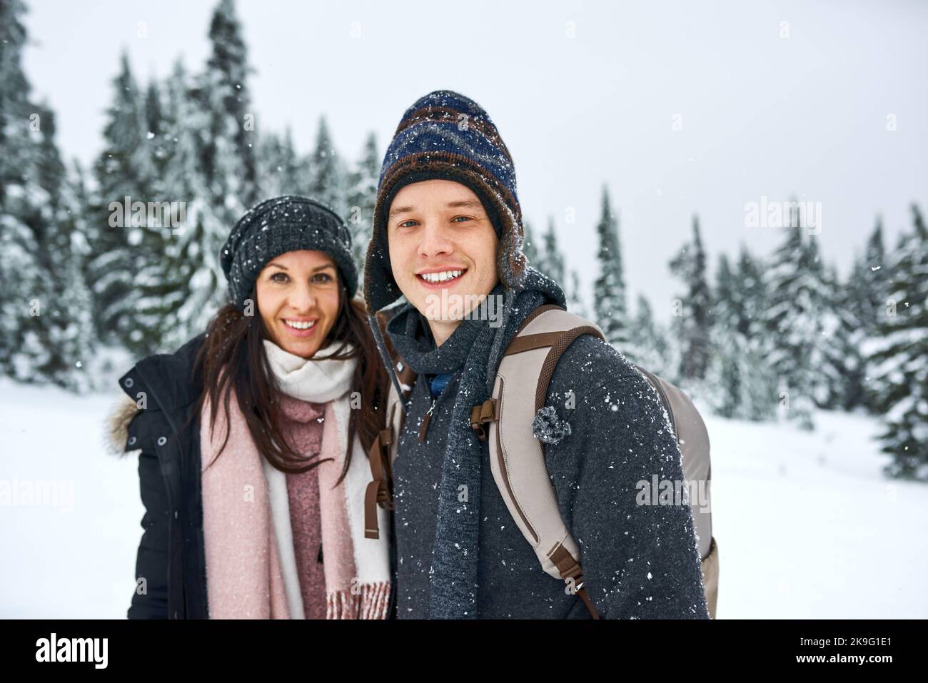 Its our favorite season of the year. a happy young couple enjoying themselves while being out in the snow. Stock Photo