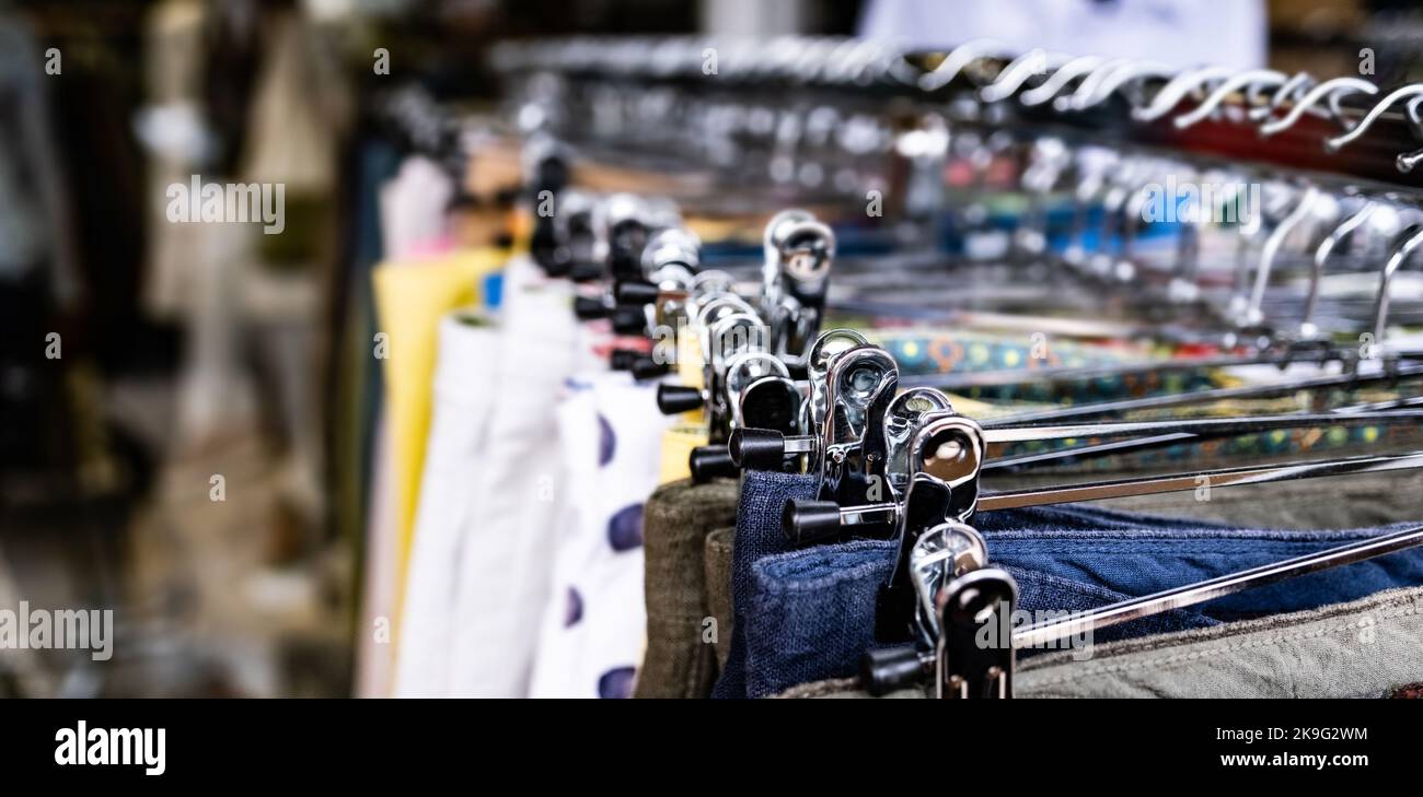 Cotton clothes on hangers Stock Photo