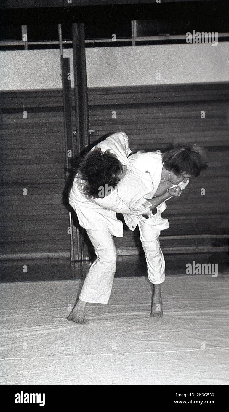 1970s, historical, inside, on a mat, two gmen competing in the sport of