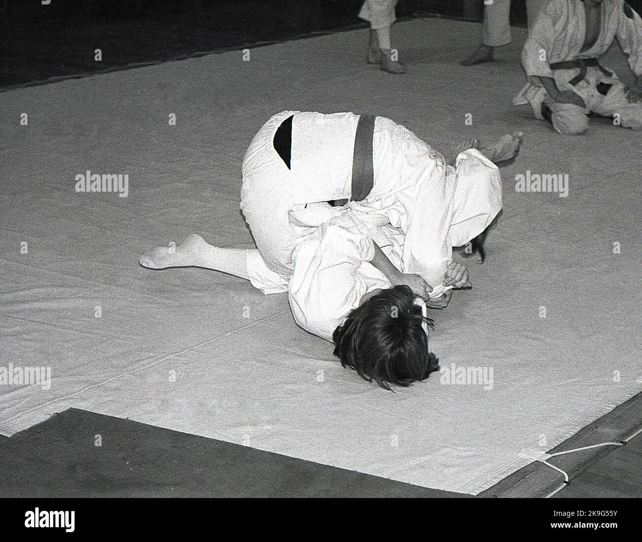1970s, historical, inside, on a mat, two girls competing in the sport