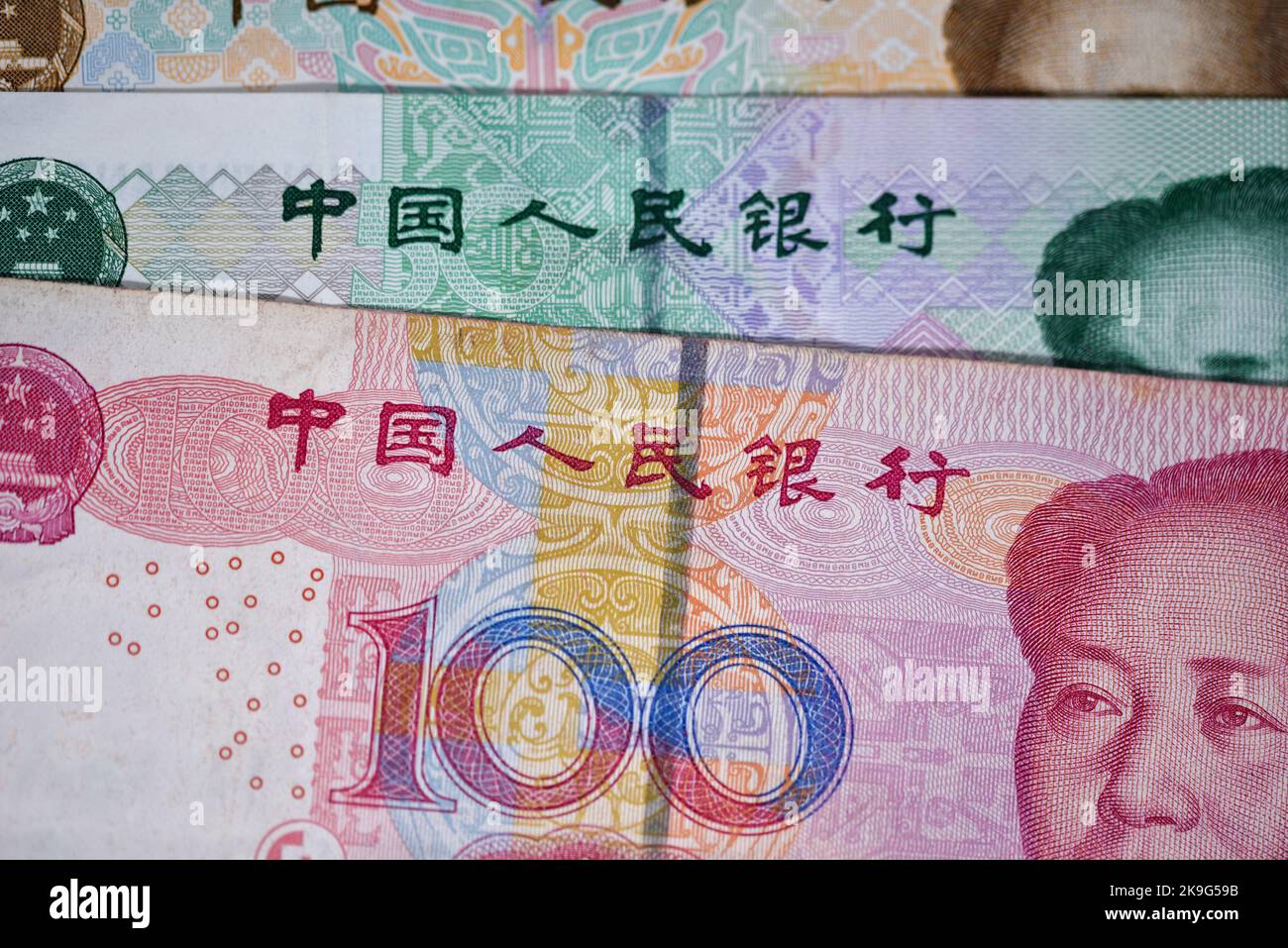 Close up of a Chinese 100 renminbi note with a 50 and 20 behind, currency used on mainland China Stock Photo