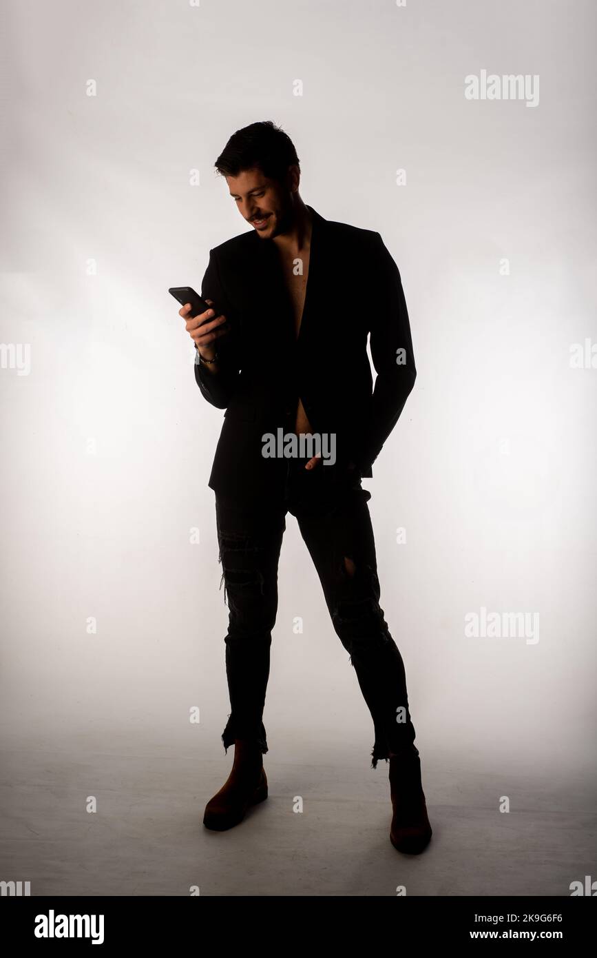 Fashion style model posing on a bright background in the studio Stock ...