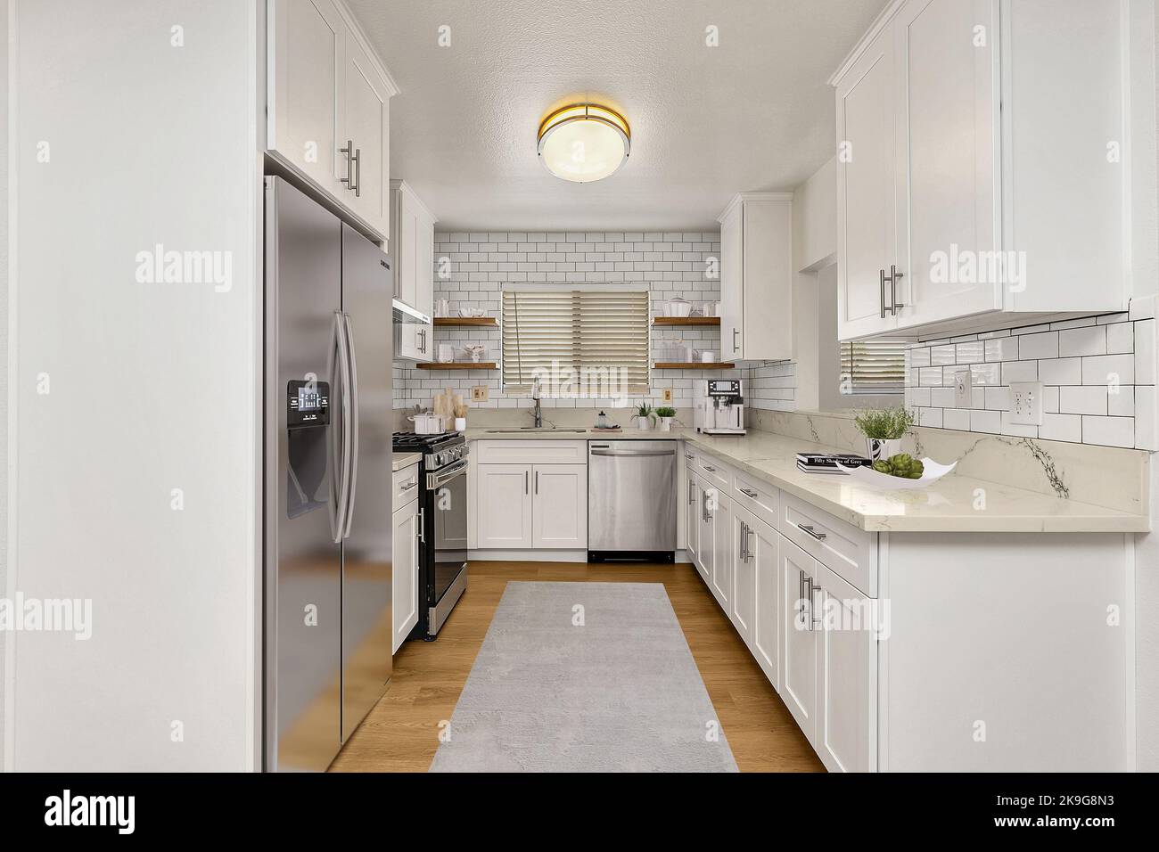 Kitchen Detail in Newly Home with hardwood floors, gray carpet, stainless steel refrigerator, black microwave, and quartz counters. 3D illustration. Stock Photo