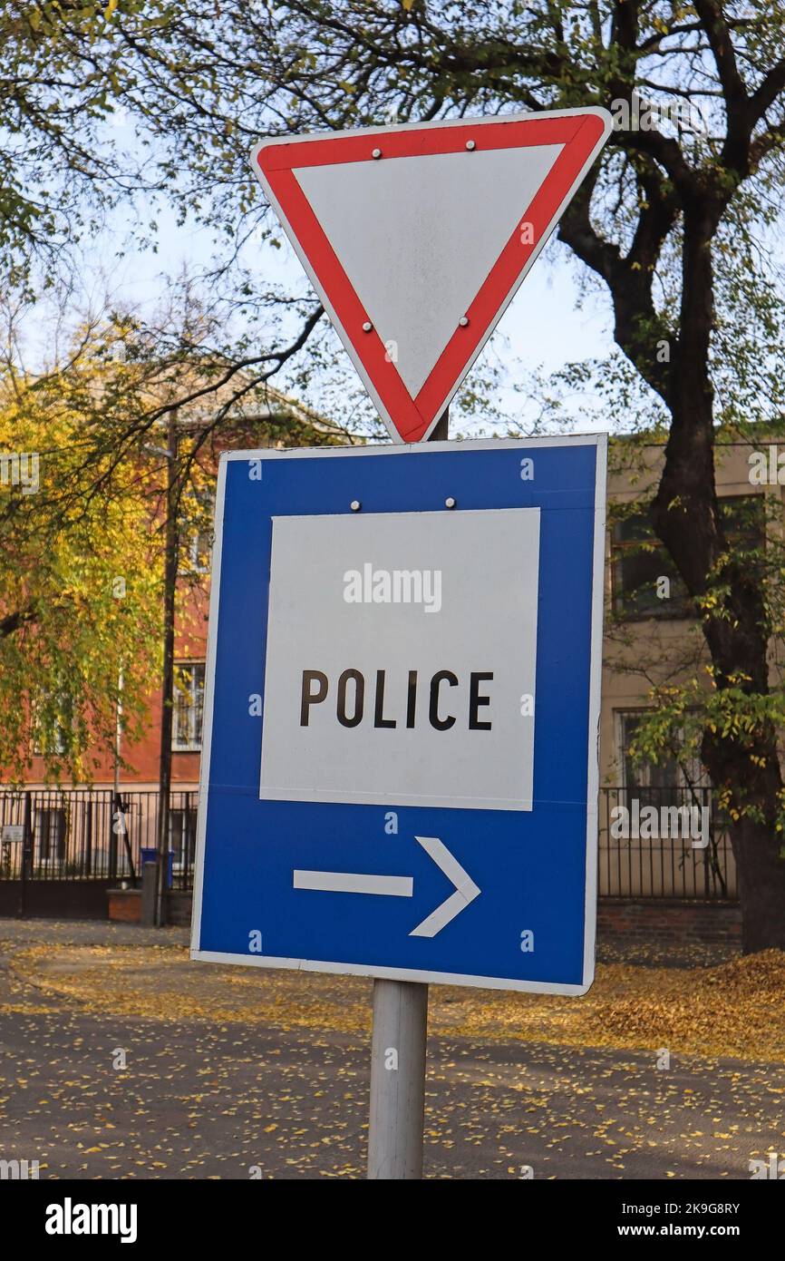Yield and police traffic sign on the street Stock Photo Alamy