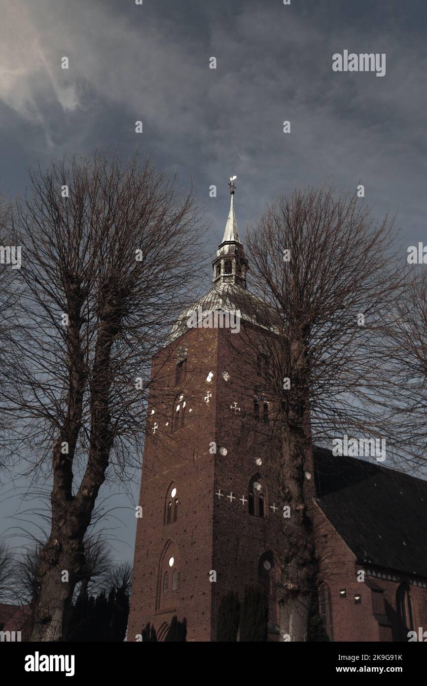 A vertical shot of the Great Tower Neuwerk in German Bight on a cloudy day Stock Photo