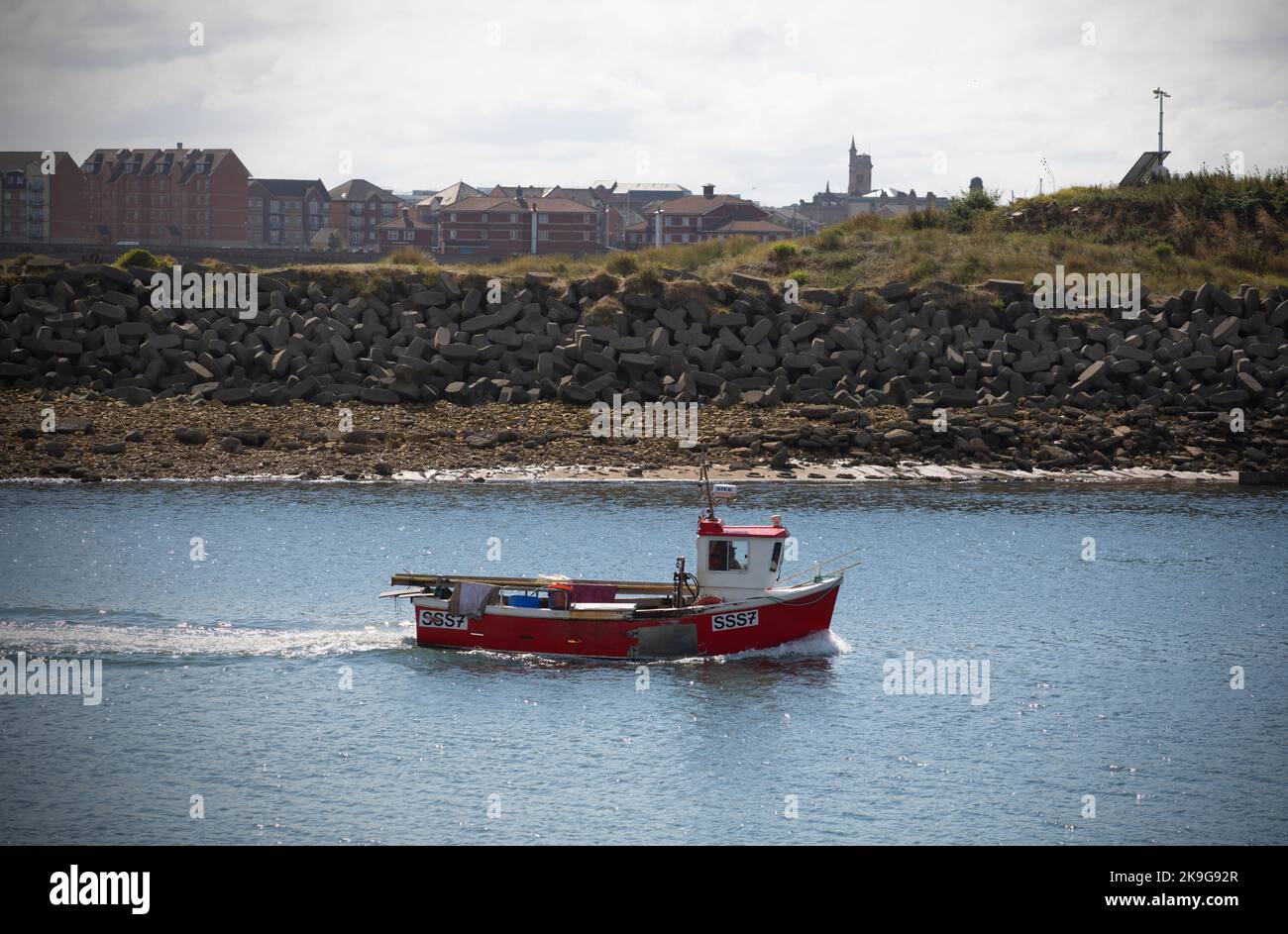A fishing boat returns to the seaside port town of Hartlepool in County Durham. local fisherman and the community have suffered in the past year with Stock Photo