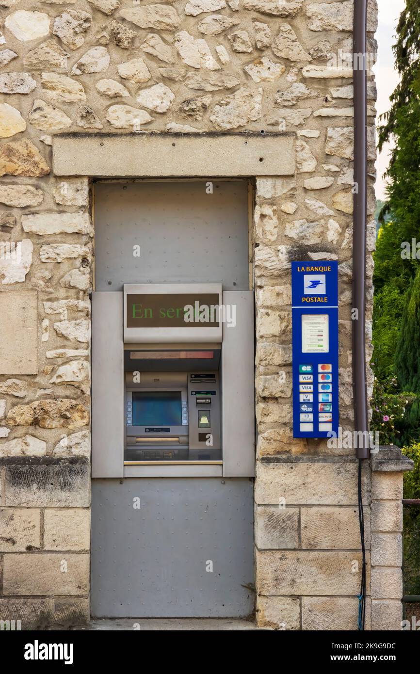 Vic-Sur-Aisne, France - Monday 25th July 2022: Cash machine, atm inset in a natural stone walled building. High quality photo Stock Photo