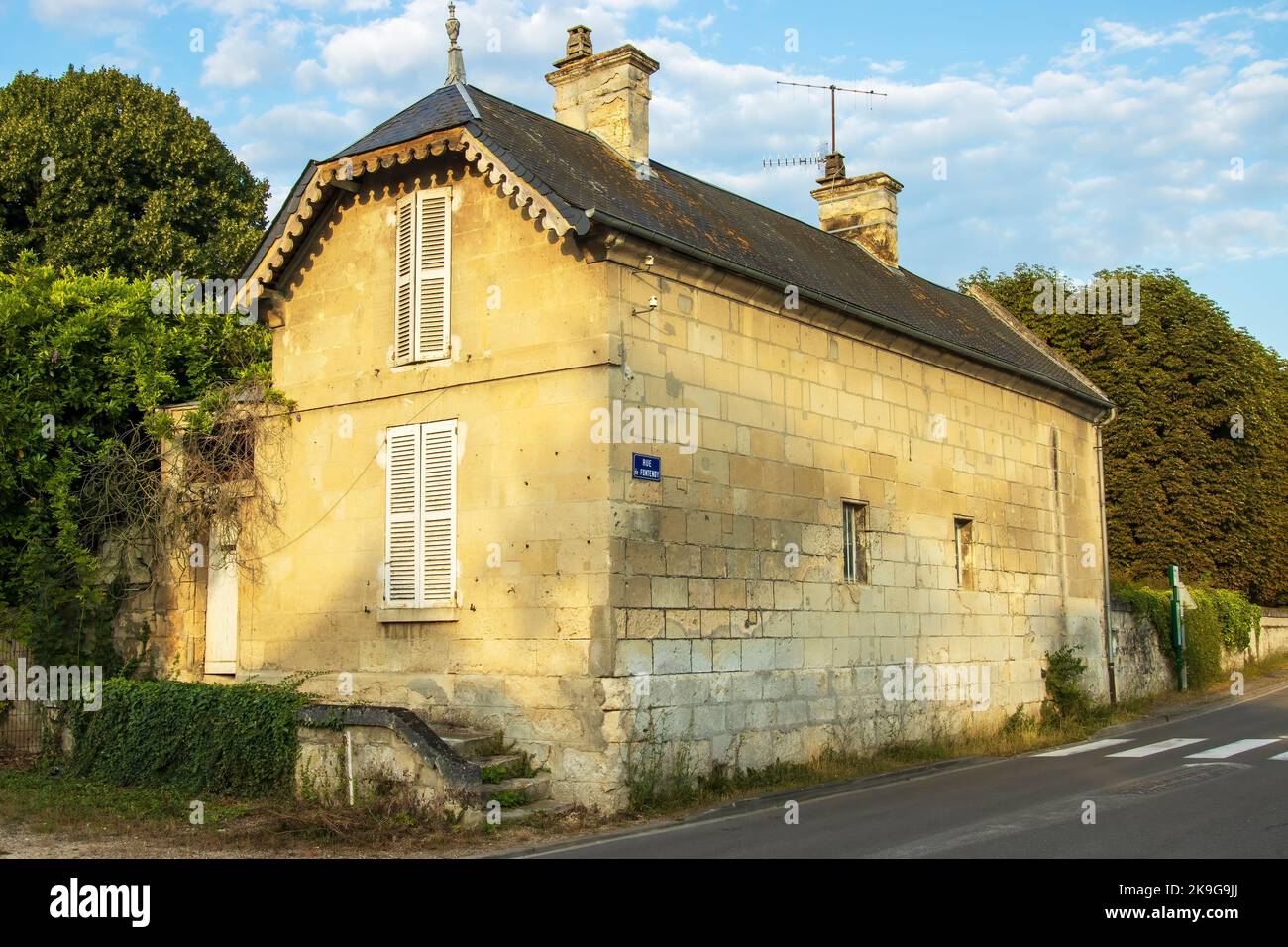 Vic-Sur-Aisne, France - Monday 25th July 2022: Beautiful stone built cottage glowing in the morning sun. High quality photo Stock Photo