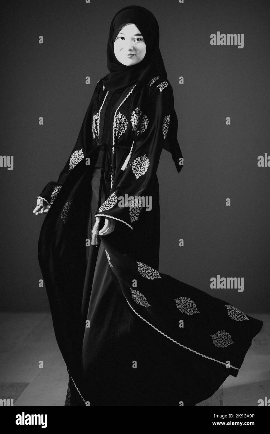 Black white photo of beautiful muslim woman in fashinable dress with ...