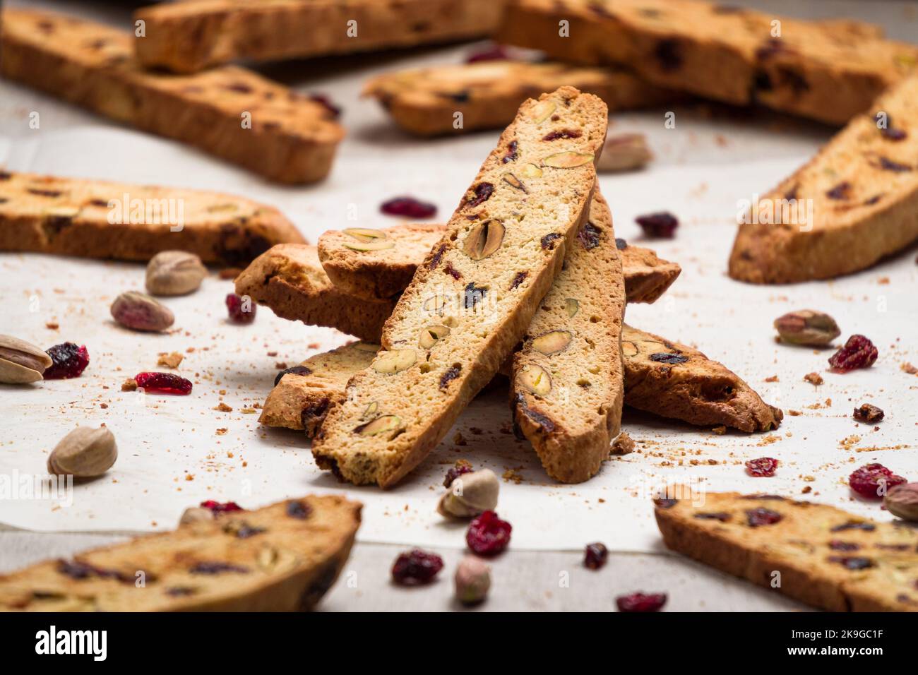 Biscotti cookies stacked vertically made with cranberry and pistachio