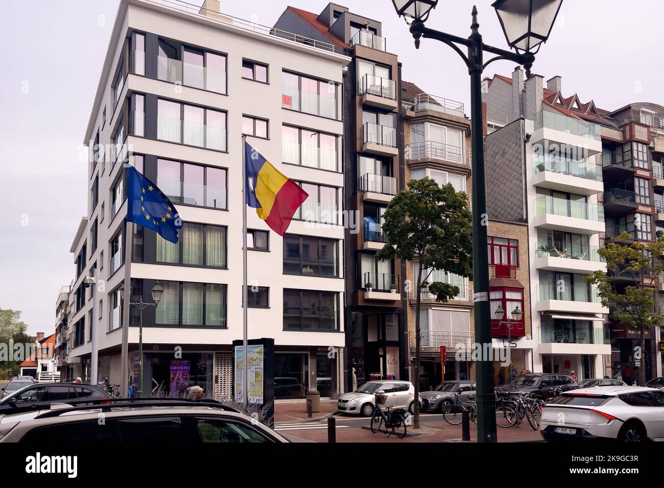 Romania flag fluttering alongside the EU one outside Stock Photo