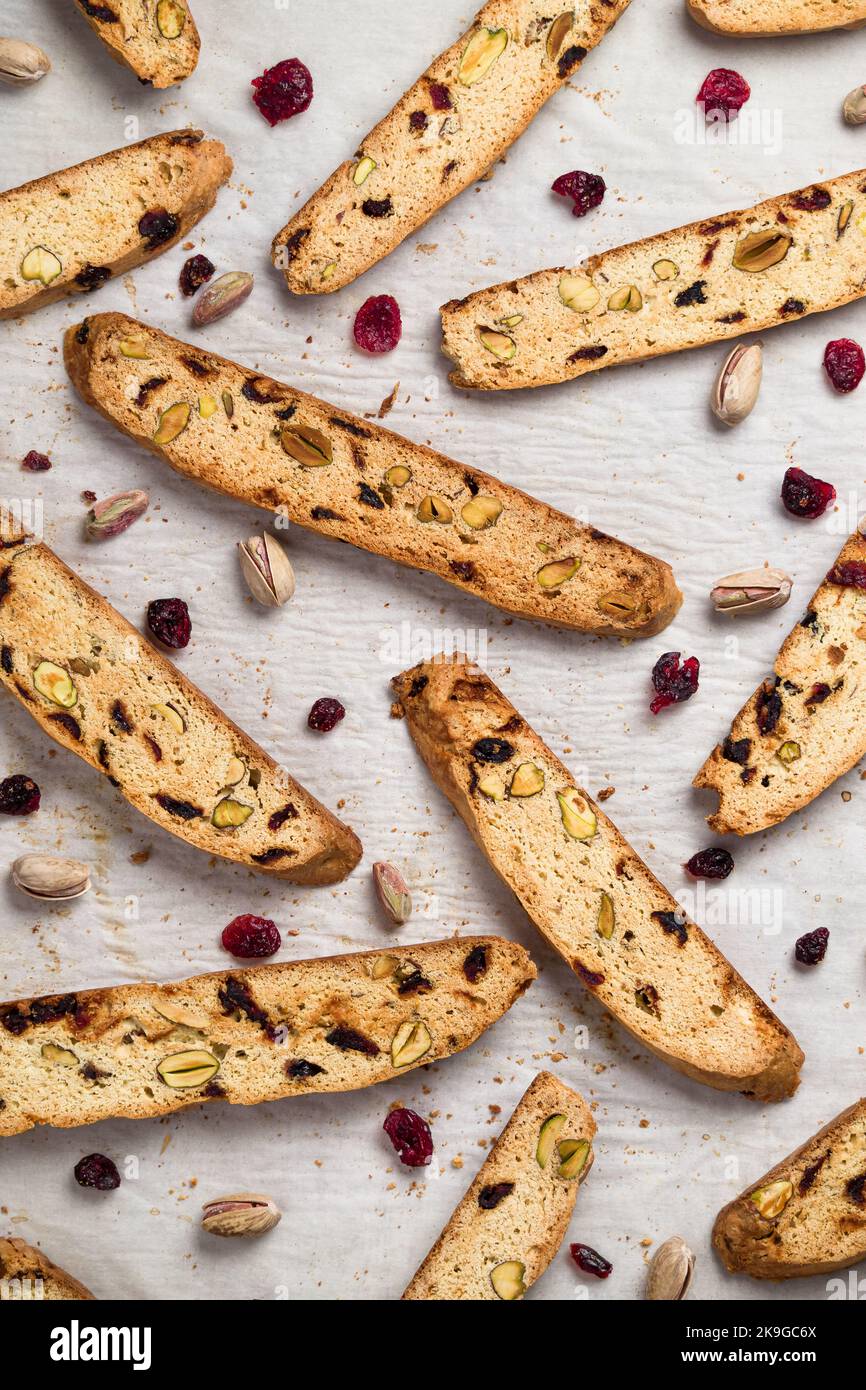 Biscotti cookies with cranberry and pistachio nuts in vertical flat lay