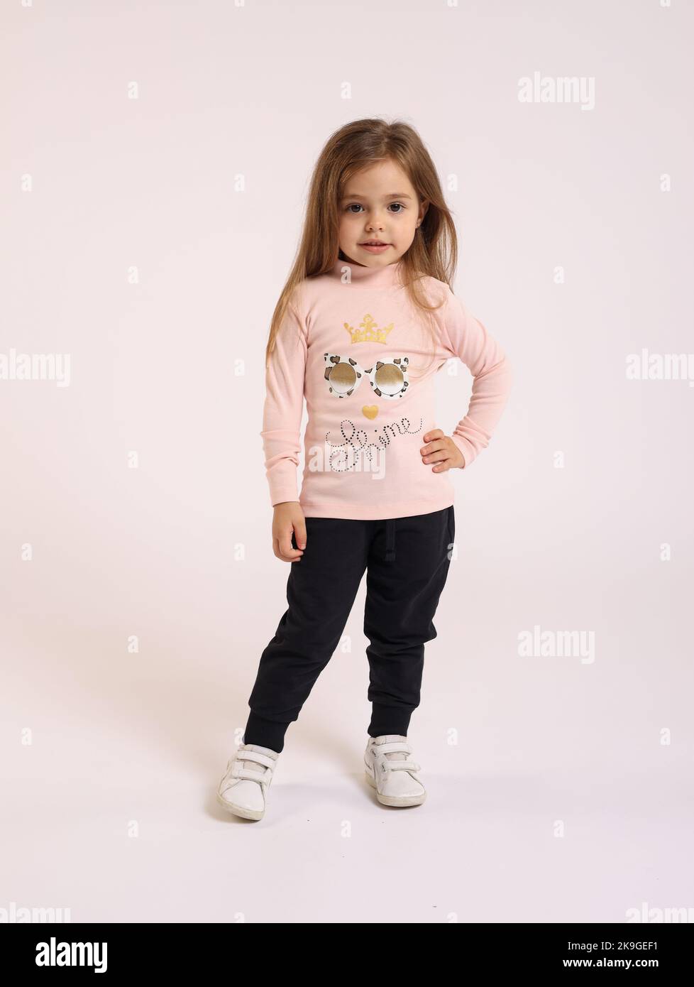 A little Caucasian girl posing on isolated white background Stock Photo ...