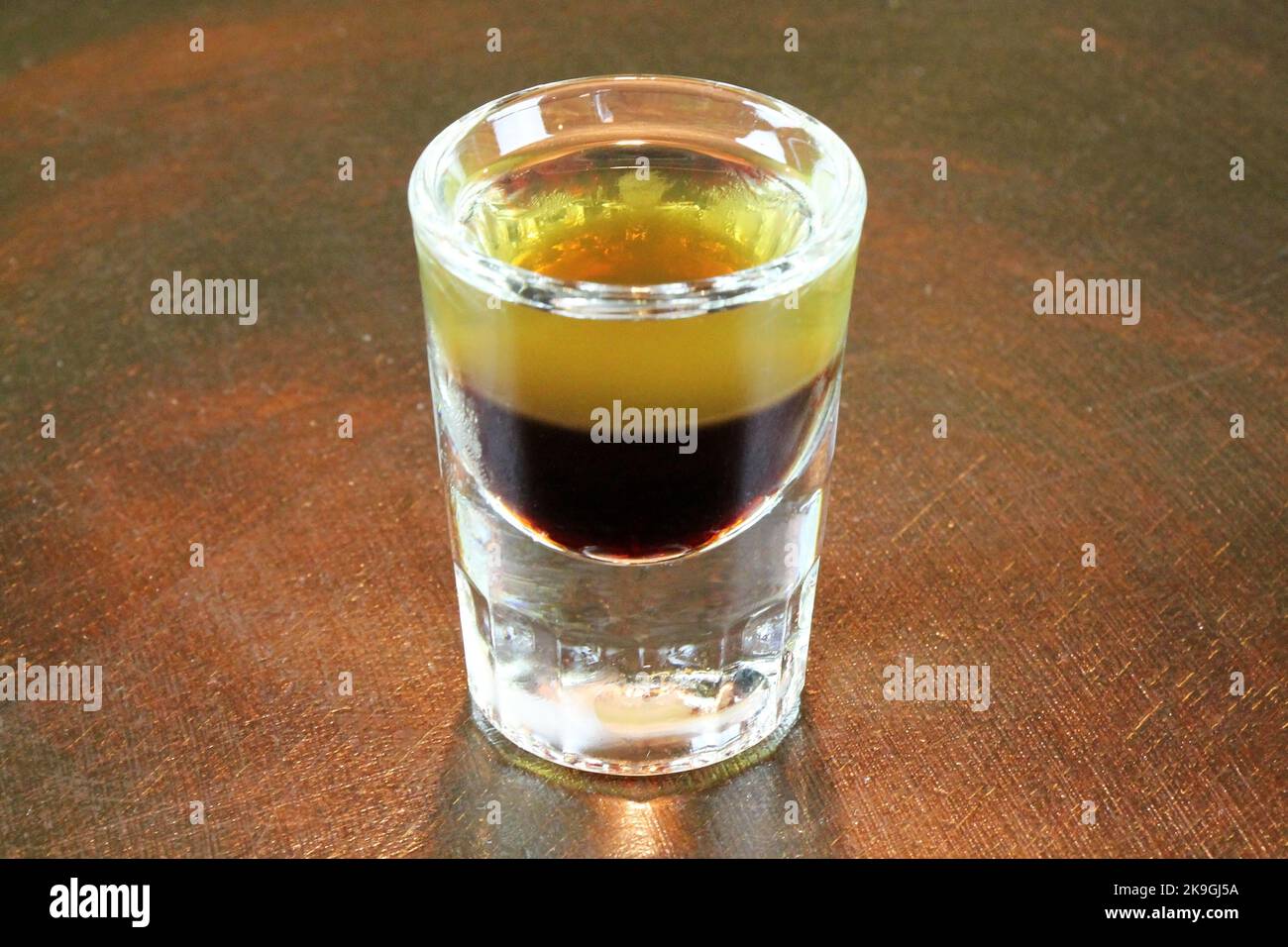 Shot drink - B52 on bar counter Stock Photo