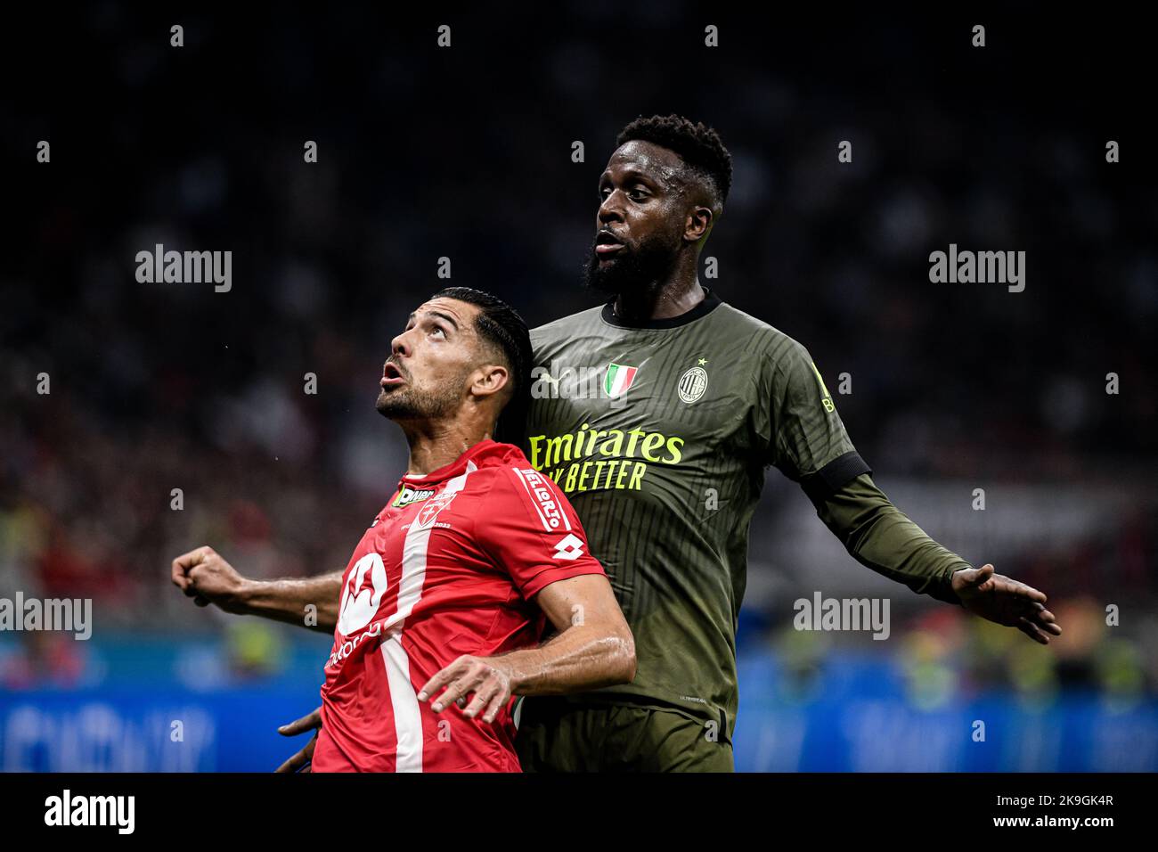 Pablo Marí of FC Monza and Divock Origi of AC Milan during the Italian Serie A football match AC Milan vs Monza at San Siro stadium in Milan, Italy on Stock Photo