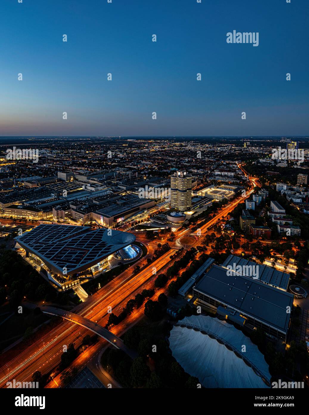 An aerial view of BMW headquarters in Munich, Germany at dusk Stock Photo