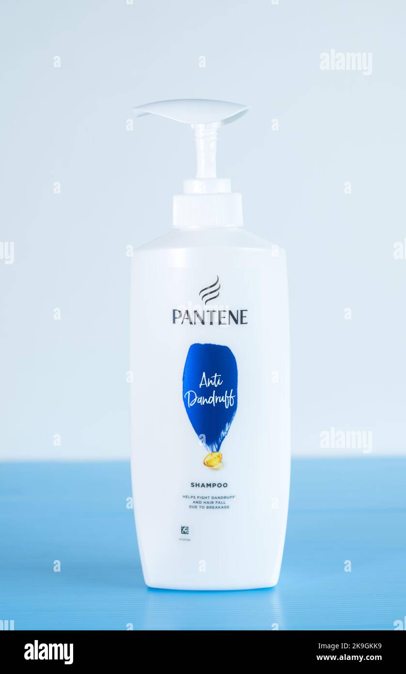 A Pantene shampoo bottle on a blue background Stock Photo Alamy