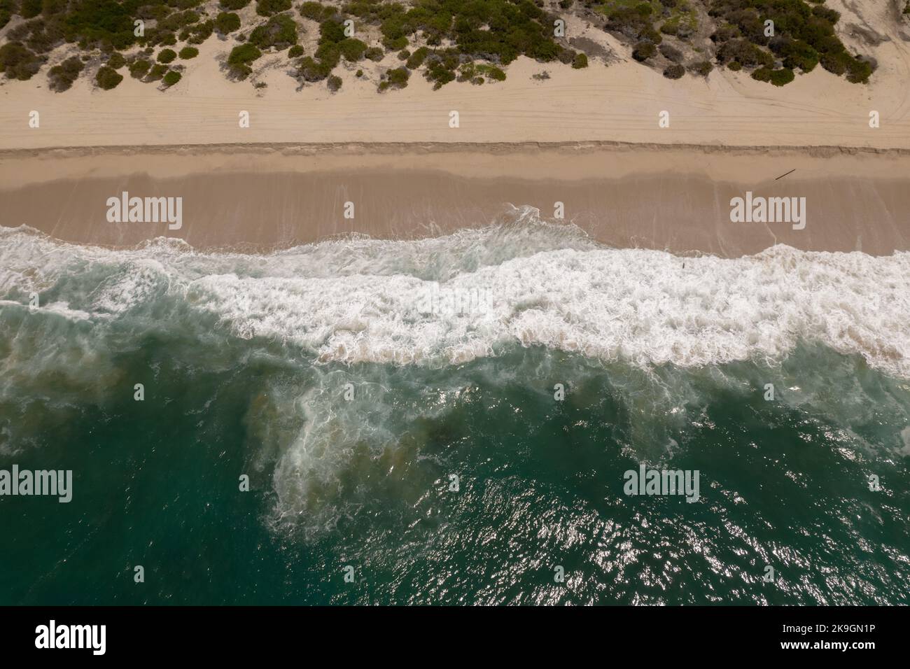 An aerial view of the splashing sea waves at the shore Stock Photo - Alamy