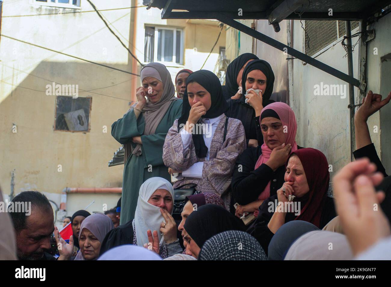 Nablus, Palestine. 28th Oct, 2022. Relatives mourn during the funeral ...
