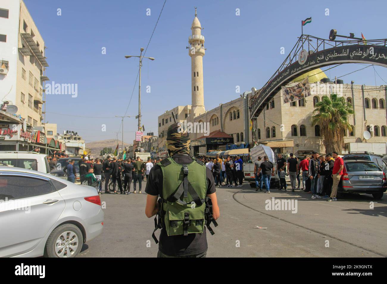 Gunmen take part in the funeral of the Palestinians Imad Abu Rashid and ...