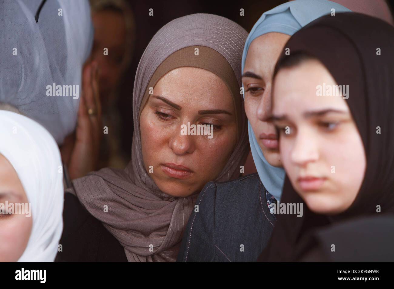 Relatives mourn during the funeral of the Palestinians Imad Abu Rashid ...
