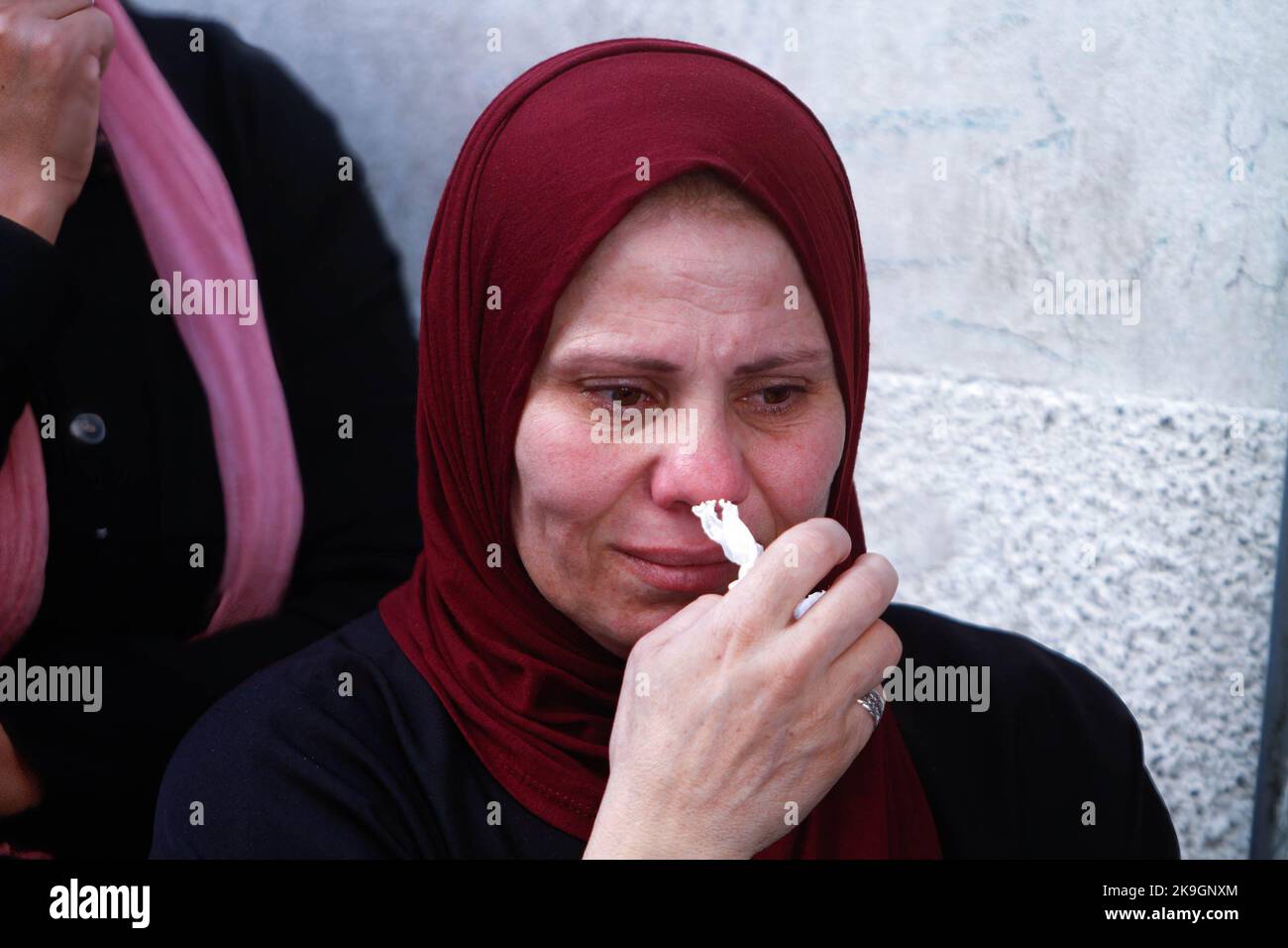 A relative mourns during the funeral of the Palestinians Imad Abu ...