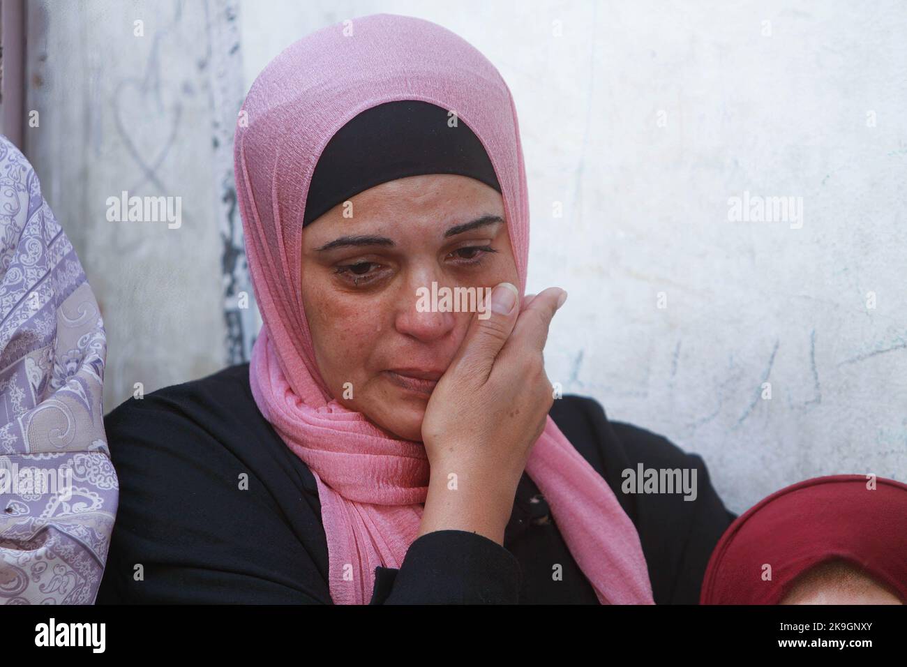 A relative mourns during the funeral of the Palestinians Imad Abu ...