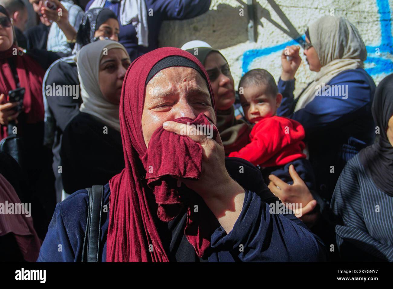 A relative mourns during the funeral of the Palestinians Imad Abu ...