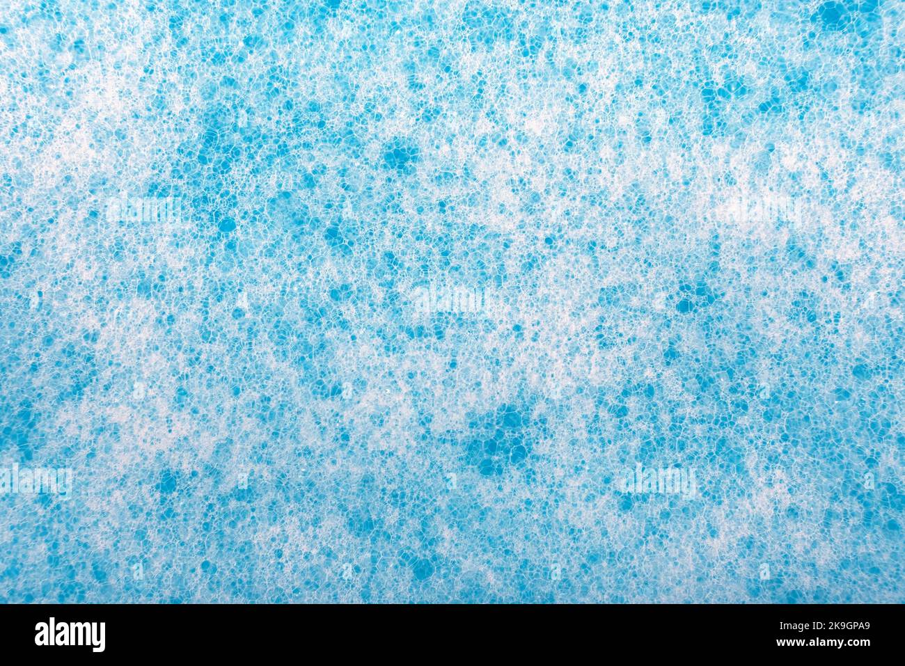 Soap foam. Background of dusty foam with bubbles of blue color for an ...