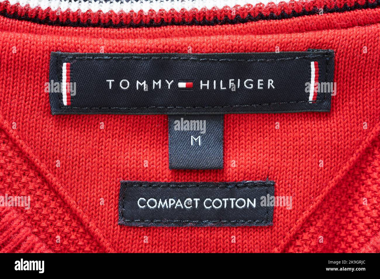 Closeup on the inner label and brand logo of a Tommy Hilfiger sweatshirt. Theme: fashion brand, male fashion, men's clothing, luxury clothes Stock Photo