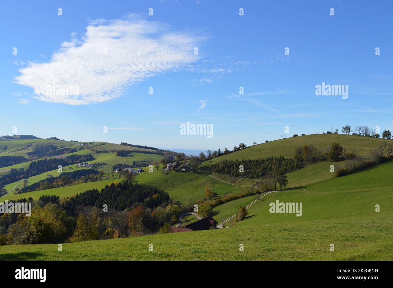 Hochkogel mountain in autumn, green hills and blue sky, Mostviertel in Lower Austria Stock Photo