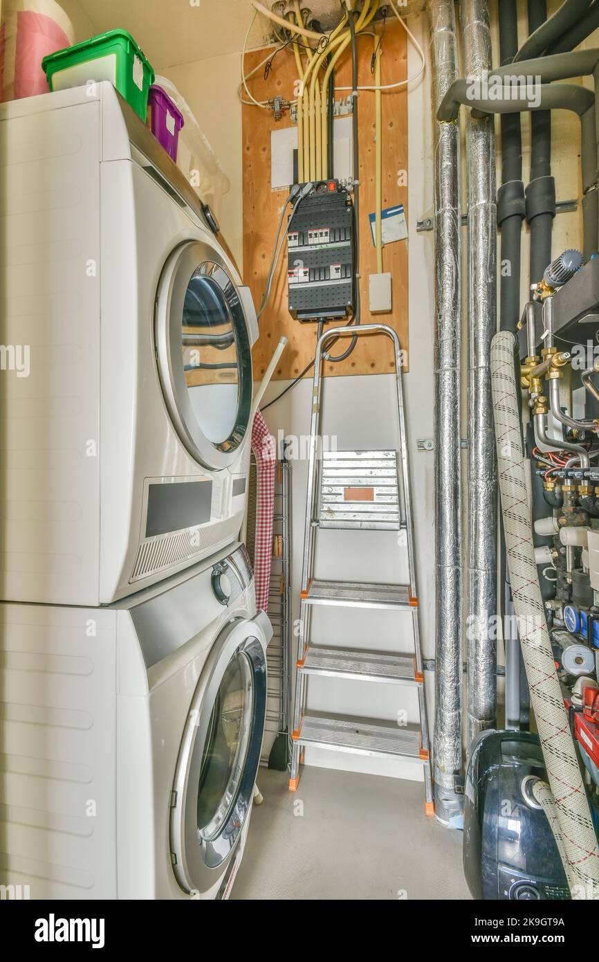 Boiler room of an apartment building with pipes and metering devices. A