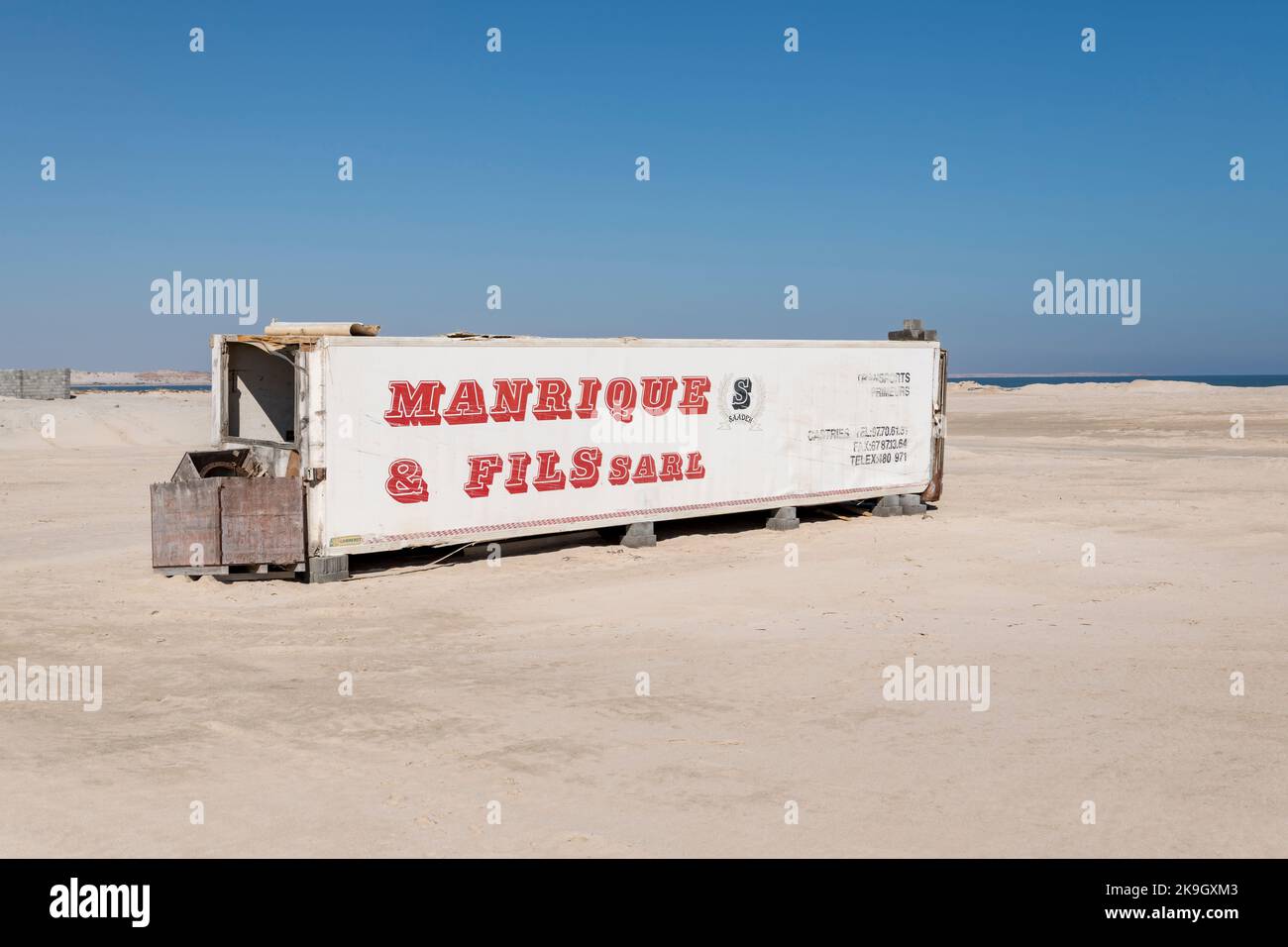 Old container abandoned in the countryside, on a beach in the Middle East Stock Photo