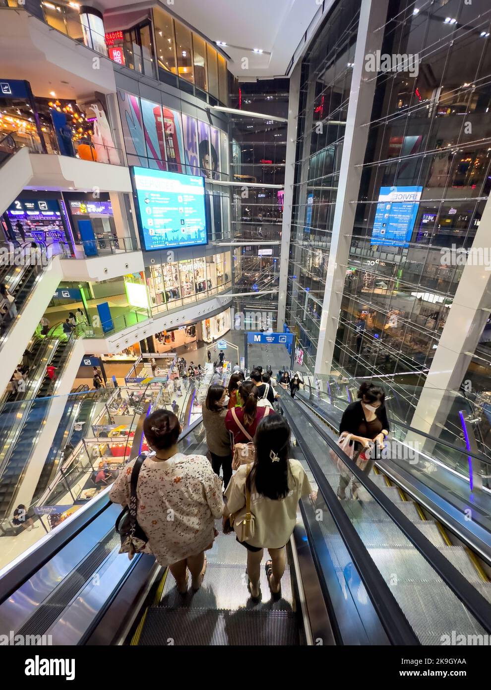 People ride escalators in the modern Pier 21 Shopping Centre in Bangkok, Thailand Stock Photo